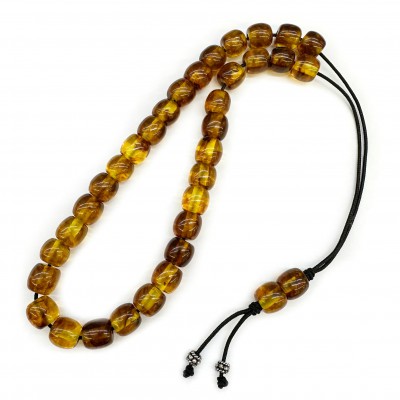 Κομπολόι με 33 χάντρες 11x10mm από σκόνη Κεχριμπάρι και ρητίνη διάφανο μελί με καφέ νερά